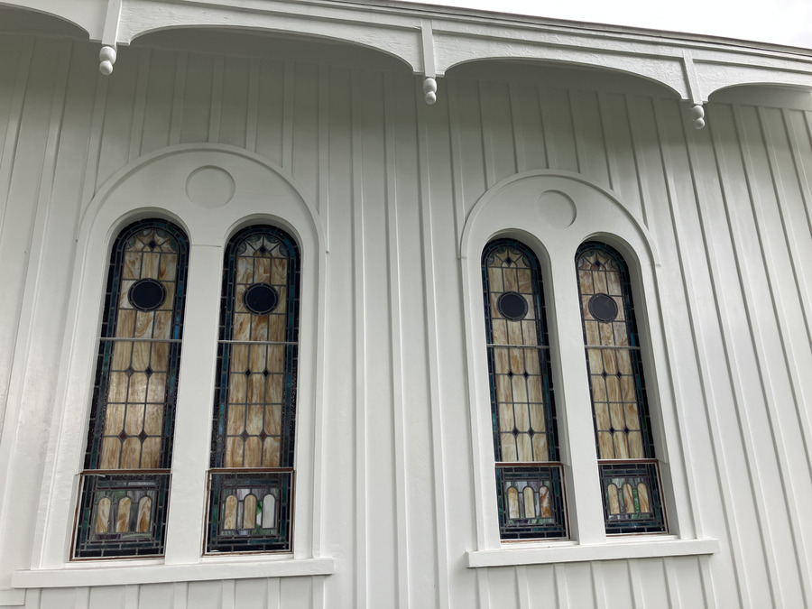 Chestnut Street Presbyterian Church: paired stained-glass windows under the eaves