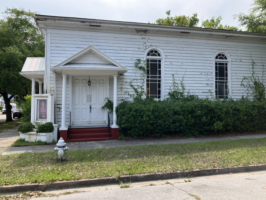 Maranatha Temple of Praise: wide front-and-side view from across the street