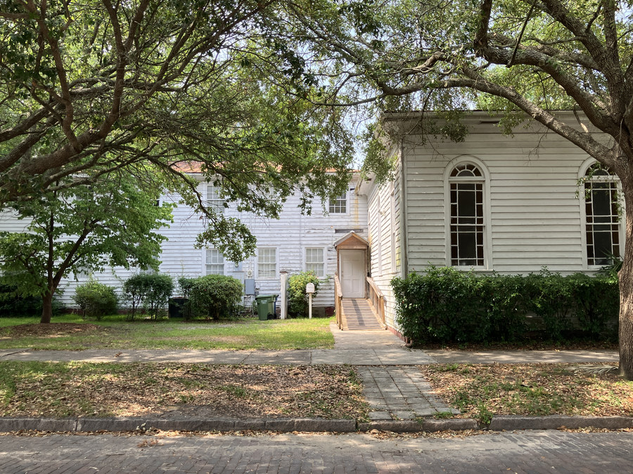 Maranatha Temple of Praise: tree-framed view of the side and rear