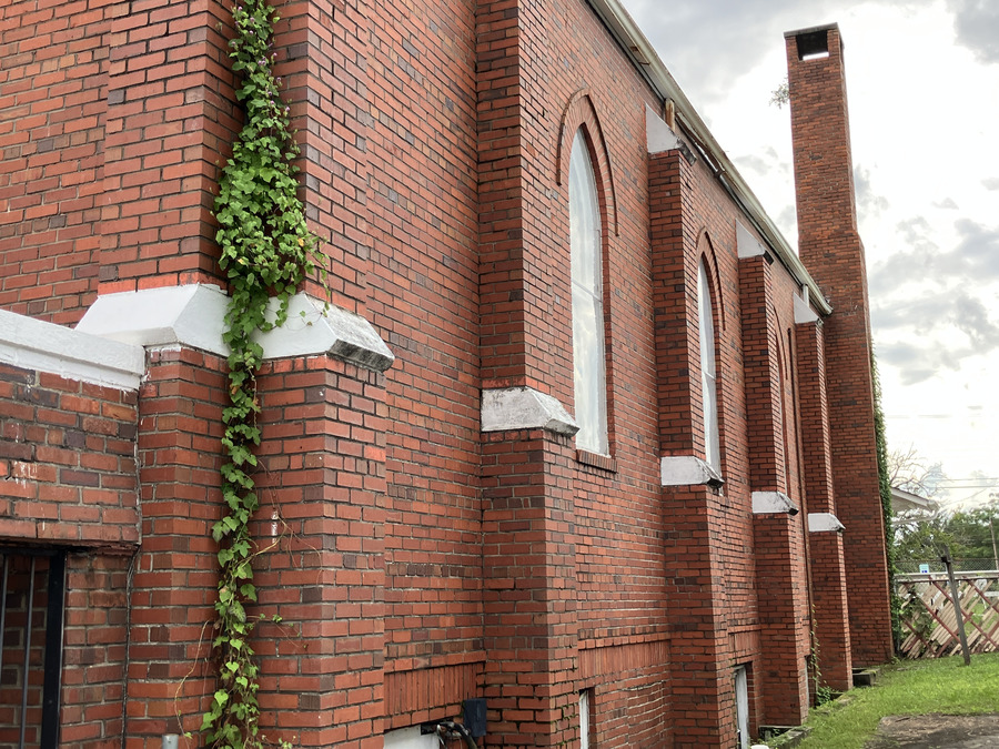 Mount Zion A.M.E. Church: brick buttresses, arched windows, and ivy