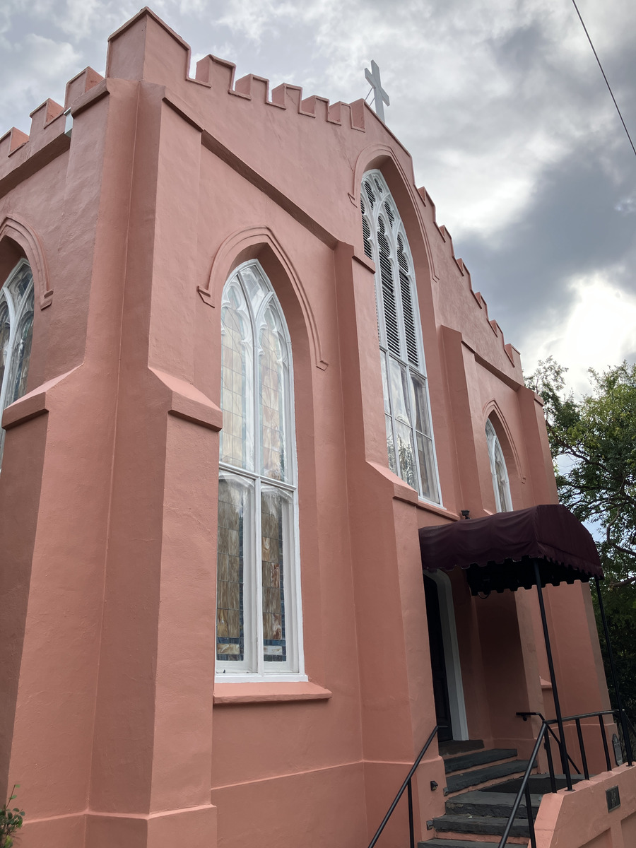 Saint Thomas Preservation Hall: tall gothic windows and entrance canopy
