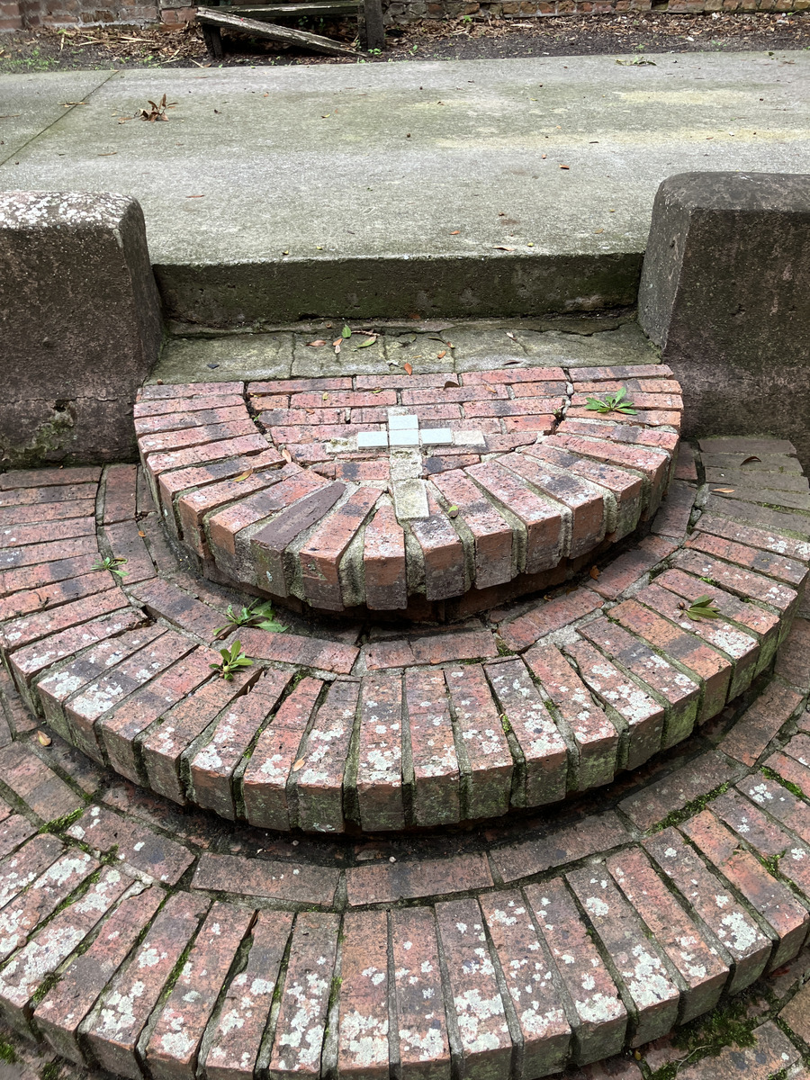 Saint Thomas Preservation Hall: brick steps with a cross motif