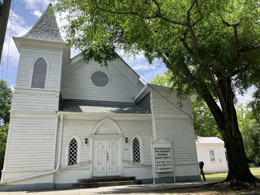 New Jerusalem Missionary Baptist Church: front façade beneath the broad tree canopy
