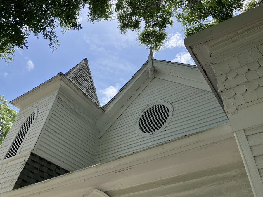 New Jerusalem Missionary Baptist Church: upward view of the tower, gable, and circular louver