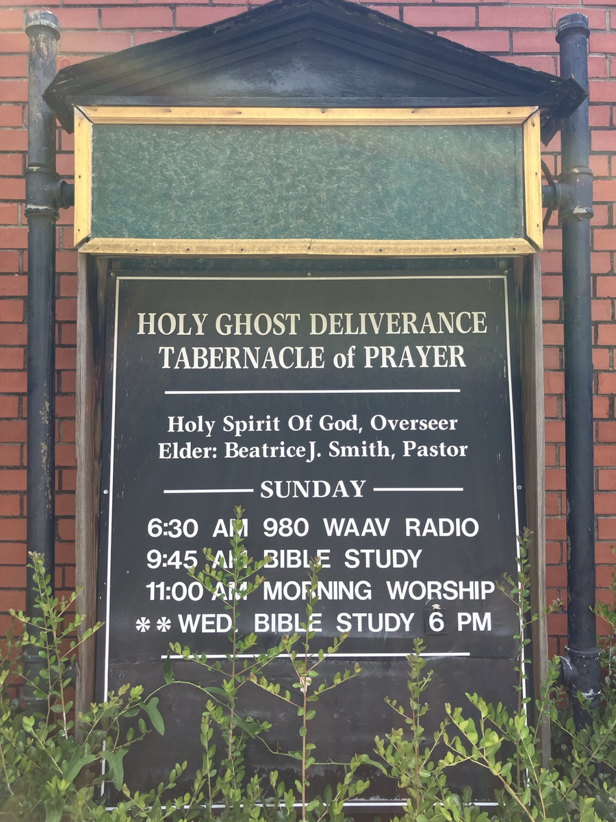 Holy Ghost Deliverance Tabernacle of Prayer: congregation sign and posted worship schedule