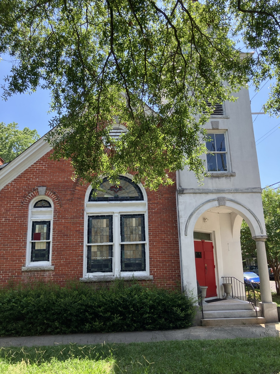 Holy Ghost Deliverance Tabernacle of Prayer: front façade framed by a mature tree