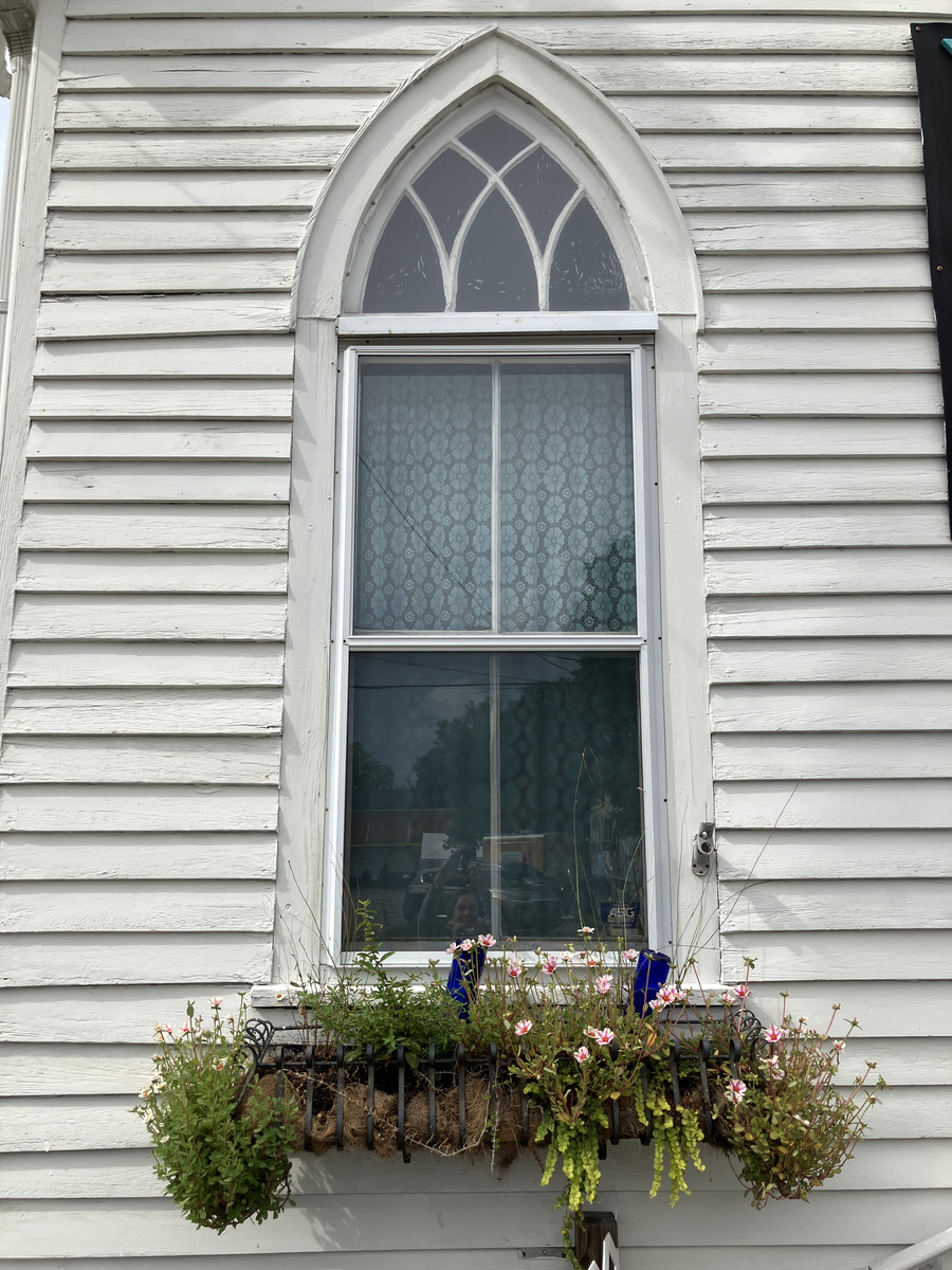 Terra Sol Sanctuary: pointed-arch window and flower box