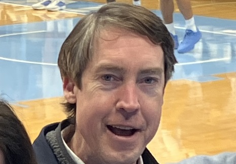 A portrait beside a basketball court.