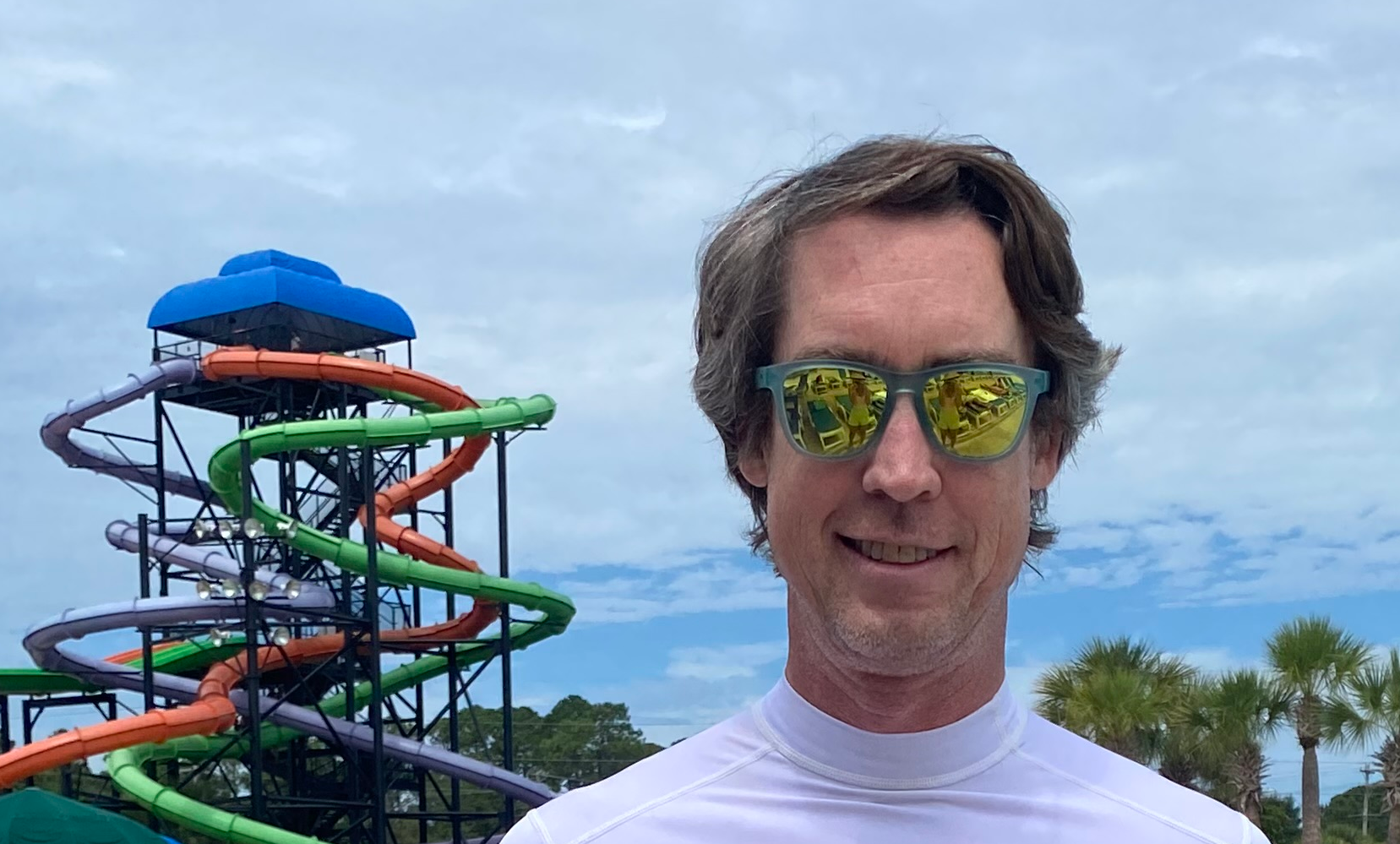 Outdoors near colorful waterslides.